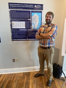 Luke presenting poster at state of the Georgia Coast