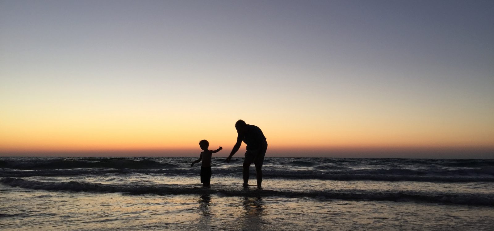 child and son at beach